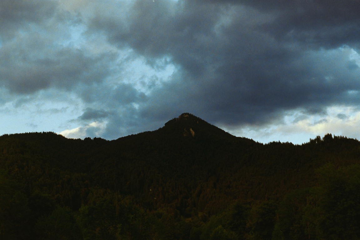 a mountain, clouds, moody